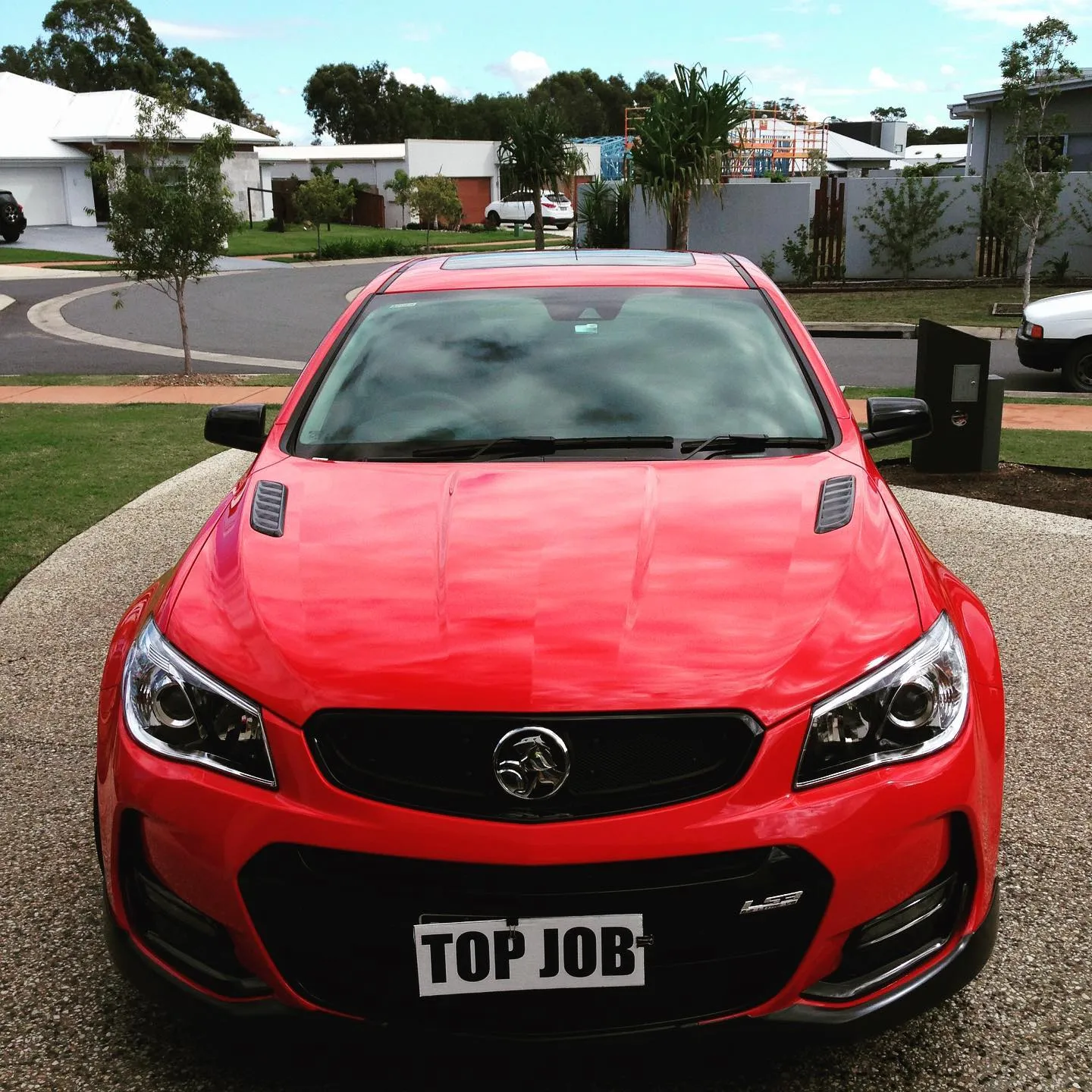 Red Holden VF SS Commodore after a detail